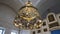 Beautiful gilded chandelier in Church. Stock footage. Panikadilo is main lamp of temple and symbol of Heavenly Church