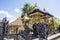 Beautiful gilded chapel with a statue at a Hindu house of Nusa Penida-Bali, Indonesia