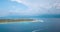 Beautiful Gili Islands in Indonesia, with Lombok island backdrop, aerial view