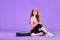 Beautiful ginger girl with glowing skin relaxing after aerobics