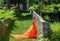 Beautiful girl in amazing fluttering orange dress.