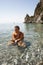 A beautiful girl bathing in amazing limpid seawater at the beach. Diving.