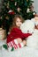 Beautiful girl with big toy is waiting Christmas and New year