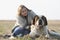 Beautiful girl with blonde hair and her big St. Bernard dog