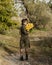 Beautiful girl with a bouquet of yellow roses. Woman with model appearance in a hat. Pretty woman. Teenager girl in a black hat