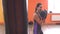Beautiful girl boxing a punching bag in the gym, workout