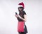 beautiful girl in braces cap santa , package for shopping smartphone