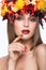 Beautiful girl with bright autumn wreath of
