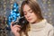 Beautiful girl celebrating New Year. garlands, bokeh. Old photo shot on film camera