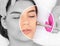Beautiful girl with clean fresh skin.Cosmetologist makes procedure microdermabrasion on the face against acne and blackheads on