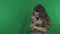 Beautiful girl communicates with kittens Scottish Fold on Green Screen stock footage video