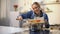 Beautiful girl cooking sauce while talking on phone, inviting friends for dinner