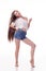 Beautiful girl dancing fun in the camera, posing against white background