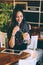 Beautiful girl drinking ice mocha shake in a cafe