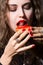 Beautiful girl eats a sandwich with red caviar