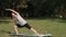 Beautiful girl engaged in gymnastics and yoga in the park