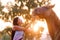 Beautiful girl feeding her handsome horse