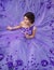 Beautiful girl in a gorgeous purple long dress.