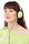 Beautiful girl with green headphones