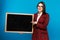 Beautiful girl holding a blackboard. study emotions