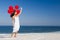 Beautiful girl holding red ballons