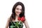 Beautiful girl holds three red roses. She is looks at the camera and smiling.