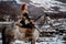 Beautiful girl on horse and with red hair in armor. Woman is a Viking. Fantasy