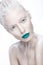 Beautiful girl in the image of albino with blue lips and white eyes. Art beauty face.