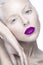 Beautiful girl in the image of albino with purple lips and white eyes. Art beauty face.