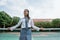 beautiful a girl Indonesian high school student standing close at the tennis net with sky