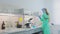 A beautiful girl in the laboratory conducts experiments. Young laboratory assistant in a chemical laboratory