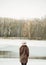 Beautiful girl on the lake and the forest