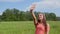 A beautiful girl launches a drone in her palm.