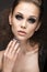 Beautiful girl in leather jacket with bright makeup and manicure Cat\'s Eye. Beauty face. Nail Design.