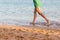 Beautiful girl legs running on the beach. pretty girl walking on water