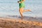 Beautiful girl legs running on the beach. pretty girl walking on water
