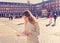 Beautiful girl looking at a map in Plaza Mayor Madrid feeling lost and looking for directions