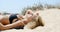 Beautiful Girl Lying on Sandy Dune