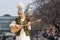 Beautiful girl in the national Kazakh costume plays the folk musical instrument dombra on the