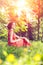 Beautiful girl on the nature in the park. Against the background