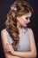 Beautiful girl with perfect skin, evening make-up, wedding hairstyle and accessories. Beauty face.