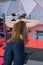 Beautiful girl performs hyperextension on a bench in the gym.