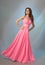 Beautiful girl in pink evening dress