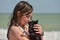 Beautiful girl playing with a dog. Outdoor portrait. series. Girl 11 years old at sea. Vacation and summer concept