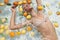 Beautiful Girl In Pool. Model Sunbathing In Water And Enjoying Fresh Citrus At SPA.