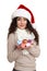 Beautiful girl portrait dressed in santa hat with handful of little gift boxes. White isolated background. New year eve and winter