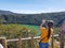 A beautiful girl possing in front of the lagoon or lake of guatavita in Colombia, source of the el dorado legend