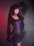 Beautiful girl in purple and black gothic outfit