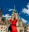 Beautiful girl in red dress travel in Prague,