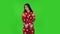 Beautiful girl in red fleece pajamas is clapping her hands indifferent. Green screen